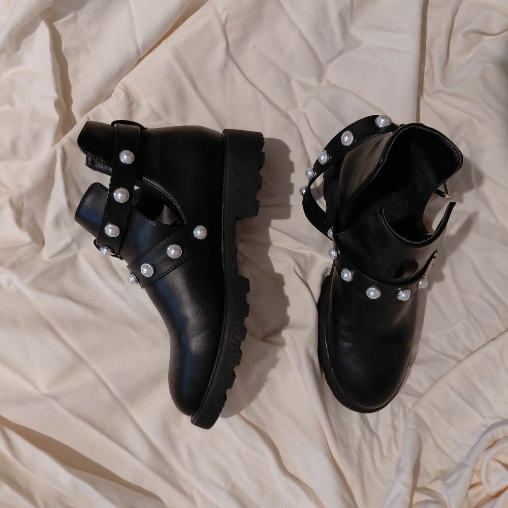Black booties with pearl embellishments